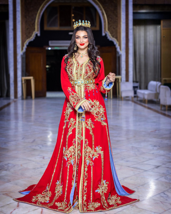 a woman in a caftan red dress